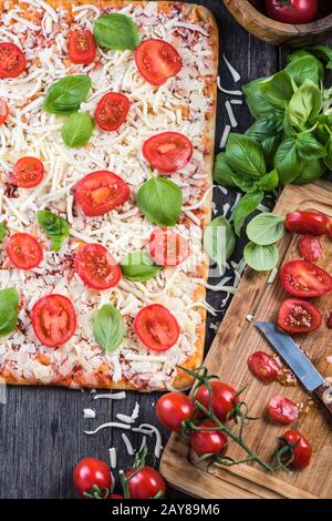 Making Homemade classic margherita pizza Stock Photo