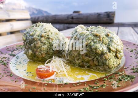 Austrian spinach dumplings on a table Stock Photo