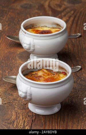 French onion soup with cheese on wood Stock Photo