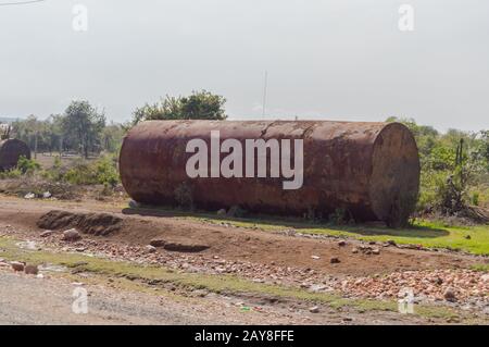 Old rusty tanker on a dirt road from Masai Mara Park Stock Photo