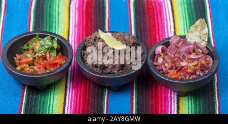 Mexican salsas on a colorful tablecloth Stock Photo