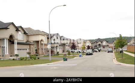 A street of new beautiful big houses in a new suburb Stock Photo