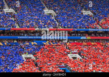 Moscow, Russia - June 14, 2018: Fans on the stadium Luzhniki raising russian flag at the opening match of the Football World Cup Stock Photo