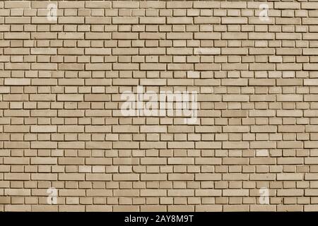 Almond Buff colored brick wall background Stock Photo