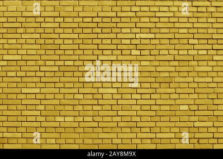 Ceylon Yellow colored brick wall background Stock Photo