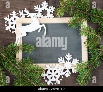 Chalkboard with Christmas decorations Stock Photo
