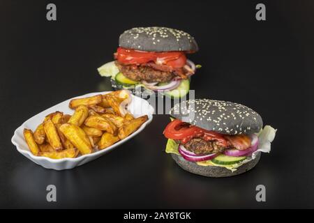 Hamburger on black slate Stock Photo