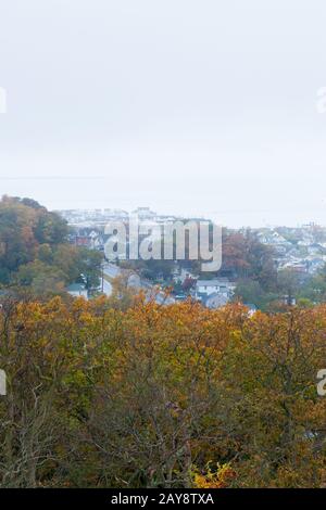 A view of the Highlands in Monmouth County and Sandy Hook as seen from the Twin Lights of the Atlantic Highlands in Autumn on a foggy day. Stock Photo