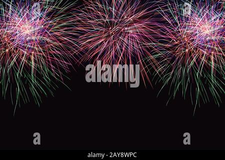 Colorful firework on the night sky. New Year celebration fireworks. Abstract firework isolated on bl Stock Photo