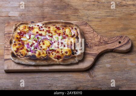 homemade French tarte flambée with wine Stock Photo