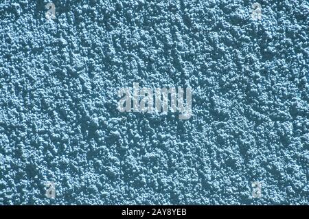 Blue color plaster house wall surface texture closeup as background Stock Photo