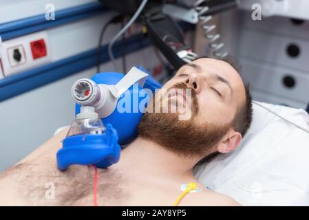 Medical urgency in the ambulance. Cardiopulmonary resuscitation using hand valve mask bag Stock Photo