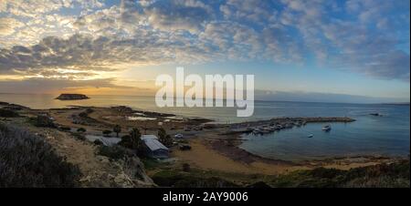 Wide panorama of sunset at Agios Georgios Fishing harbor. Paphos Stock Photo