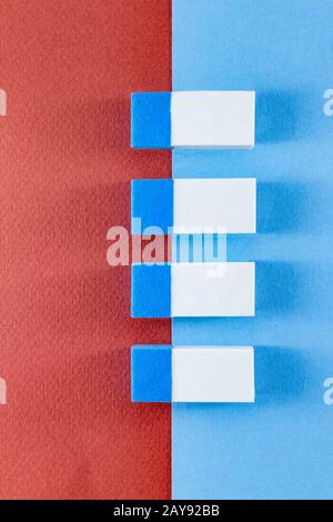 Top view of colorful erasers on  color papers in portrait Stock Photo