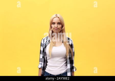 Beautiful pretty charming young blonde woman smiling happily, having fun indoors, playing with long straight hair. Pretty girl l Stock Photo