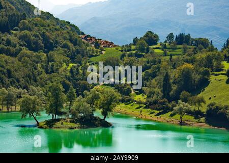 Lake Tenno, a turquoise green lake in Trentino, Italy Stock Photo