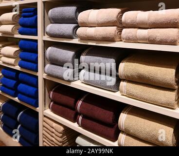 Towels on shelves Stock Photo