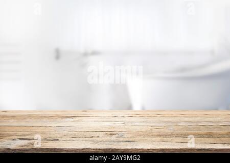 Empty wooden top table with blurred bathroom background for product display montage. Stock Photo