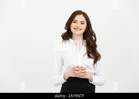 Businesswoman standing in studio office and holding hands. Stock Photo