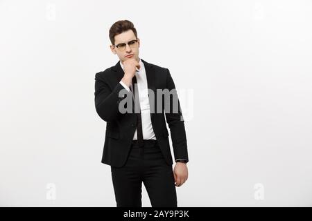 Business Concept: Portrait of Thoughtful handsome Businessman wearing smart suit in thinking gesture isolated over white backgro Stock Photo