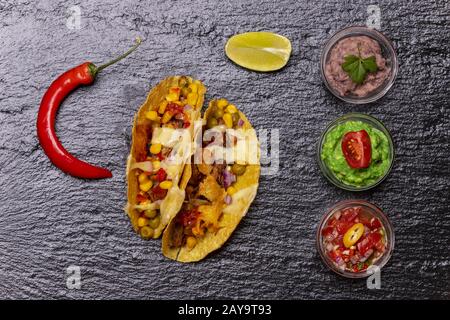 baked tacos with salsa Stock Photo