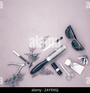 Cosmetics items on a light green background. Stock Photo