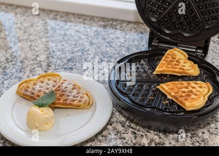 delicious heart shaped waffle made with sweet vanilla ice cream Stock Photo