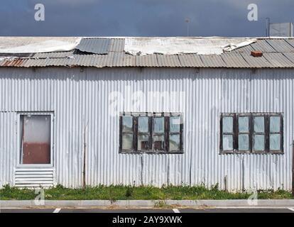 A rusty old corrugated metal shack Stock Photo - Alamy