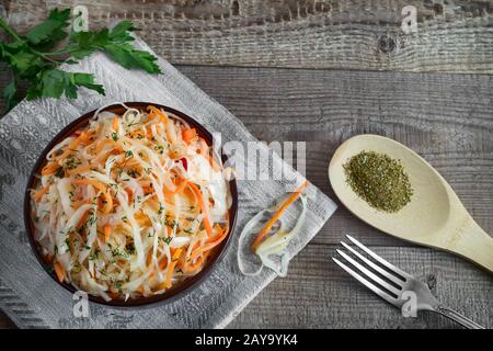 Sauerkraut with carrots in a ceramic Cup. Stock Photo