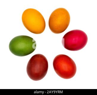 Six colorful Easter eggs flat lay in a circle and isolated on plain white background Stock Photo