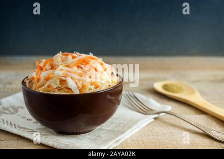 Sauerkraut with carrots in a ceramic Cup. Stock Photo