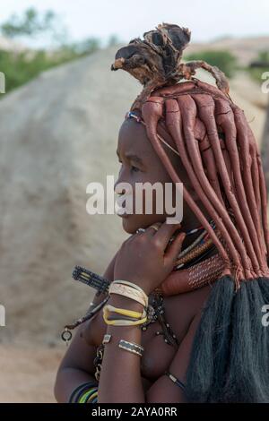Portrait of a Himba woman in a Himba settlement in the Damaraland of northwestern Namibia. Stock Photo