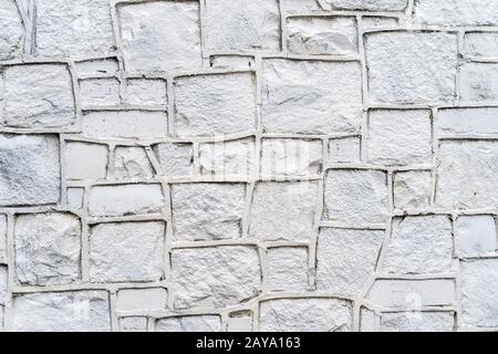 Old rustic white stone wall High quality texture and background Stock Photo