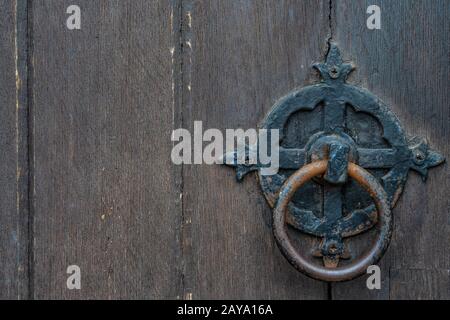 Vintage black door panels with ancient knocker.-High quality texture and background Stock Photo
