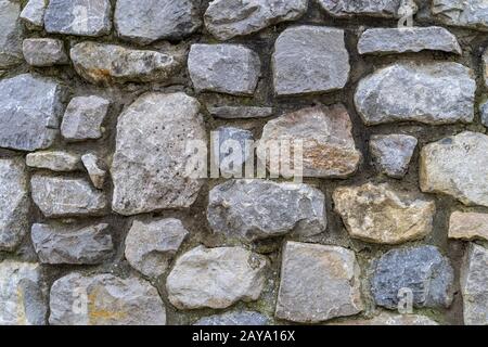 Old rustic stone wall High quality texture and background Stock Photo