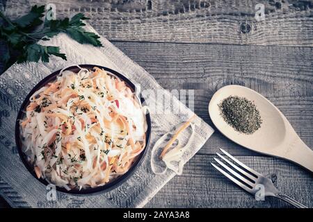 Sauerkraut with carrots in a ceramic Cup. Stock Photo
