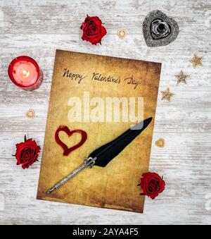Happy Valentines Day card with love hart, roses, candle and quill Stock Photo