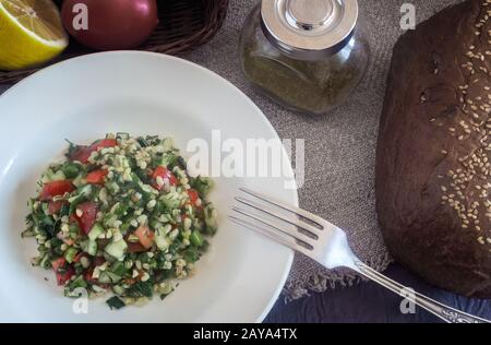 Salad Tabule - a common dish of Arabic cuisine. Stock Photo