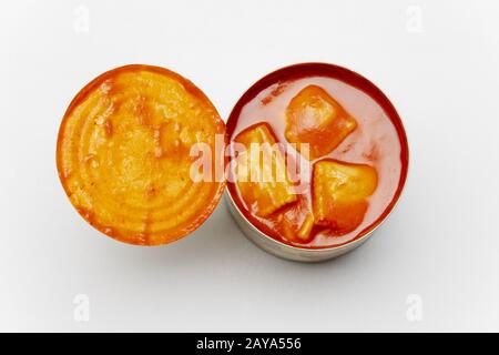 open tin of ravioli on white background Stock Photo