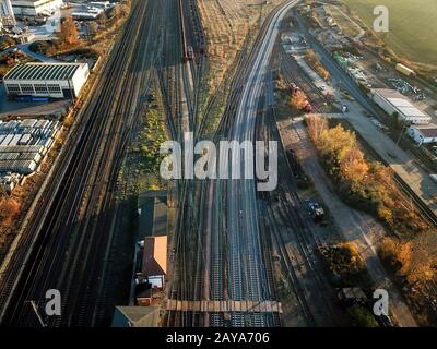 Infrastructure of track system with trains, switches, road bridges and rails Stock Photo