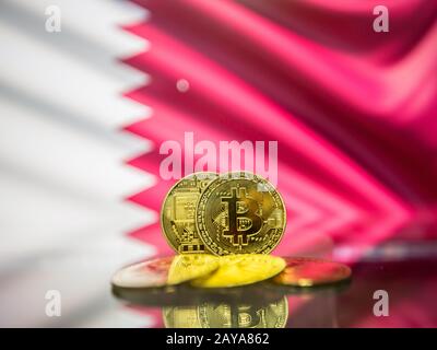 Bitcoin gold coin and defocused flag of Bahrain background. Virtual cryptocurrency concept. Stock Photo