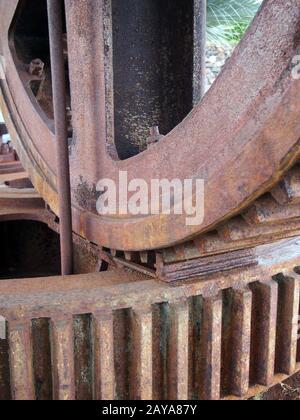 close up details of large old rusty steel industrial cog wheels Stock Photo