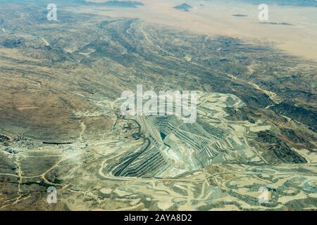 Aerial photo from the flight to Sossusvlei of the Rossing Uranium Mine in Namibia is the longest-running and one of the largest open pit uranium mines Stock Photo