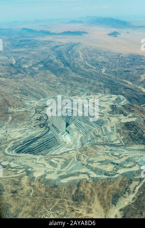 Aerial photo from the flight to Sossusvlei of the Rossing Uranium Mine in Namibia is the longest-running and one of the largest open pit uranium mines Stock Photo