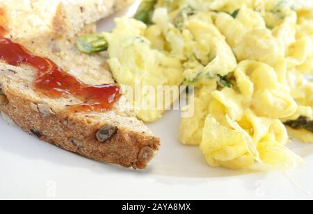 Toasted artisanal bread and scrambled egg Stock Photo
