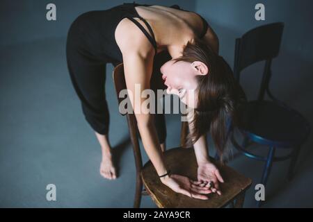 The social theme female loneliness pain suffering. Abastration male violence family. A young beautiful Caucasian woman in black Stock Photo