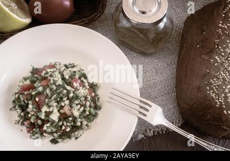 Salad Tabule - a common dish of Arabic cuisine. Stock Photo