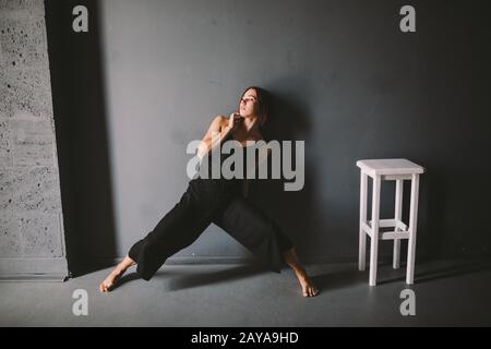 social theme of female loneliness is pain suffering. Abastration of male domestic violence. Young beautiful Caucasian woman in b Stock Photo