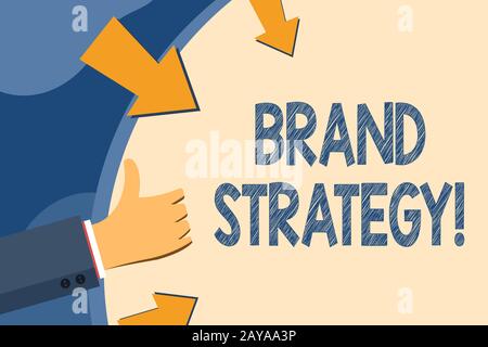 Text sign showing Brand Strategy. Conceptual photo long term plan development of successful brand achieve goals Hand Gesturing T Stock Photo