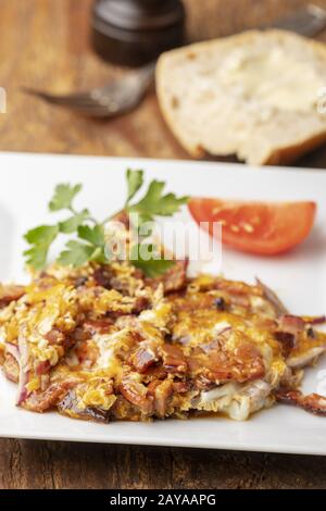 Close up of scrambled eggs with bacon Stock Photo